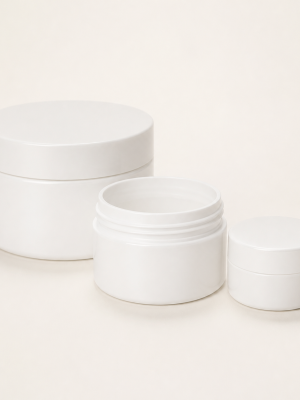 Empty white polypropylene aqueous cream jars in assorted sizes