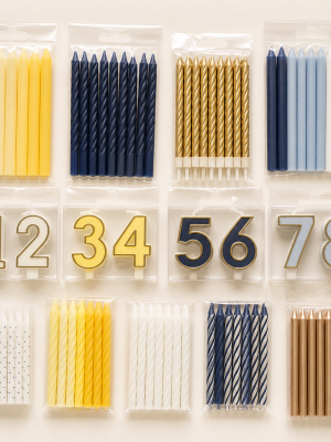 Assorted slim spiral numeral and metallic cake candles in plain packs