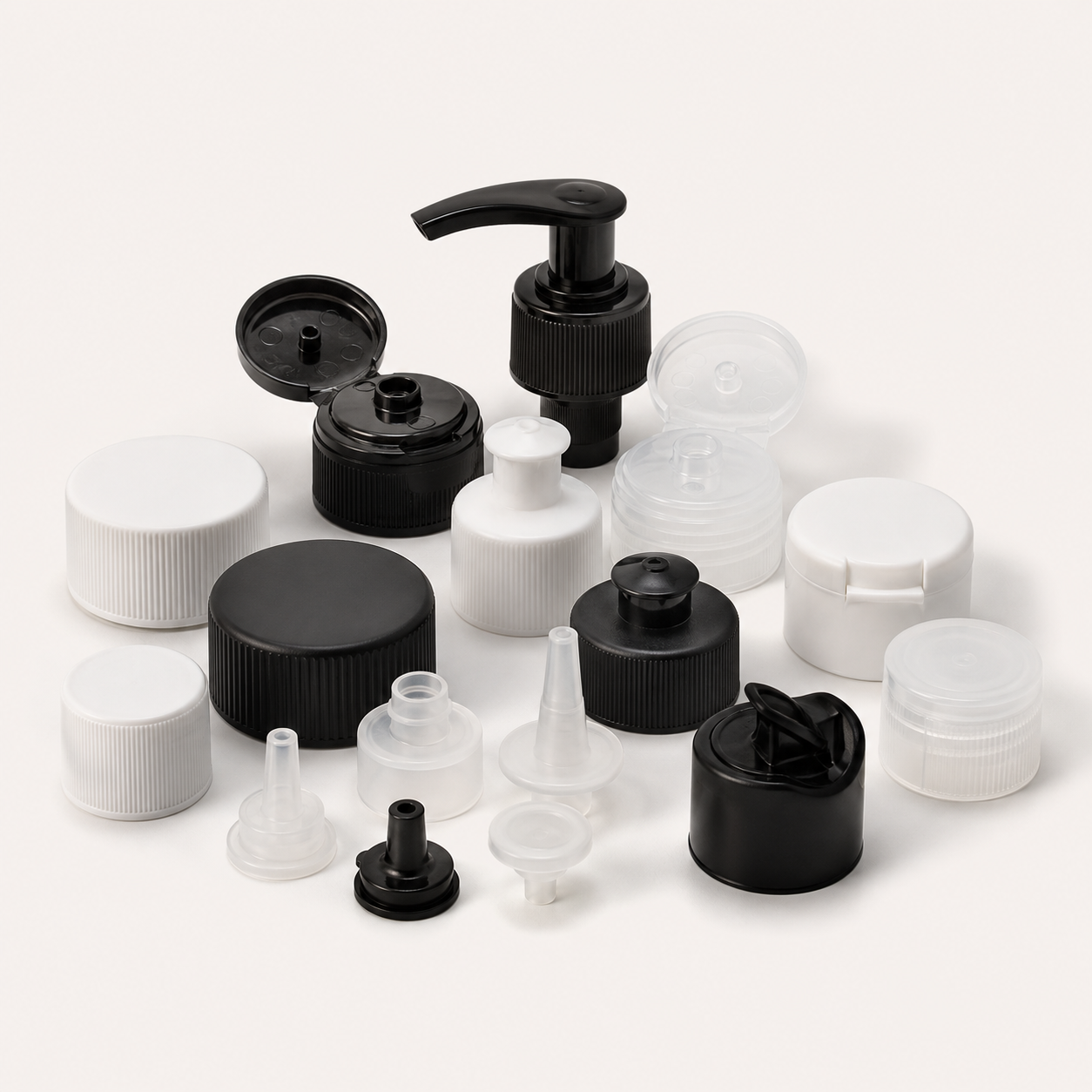 Assorted bottle closures including screw caps flip tops spouts and pumps