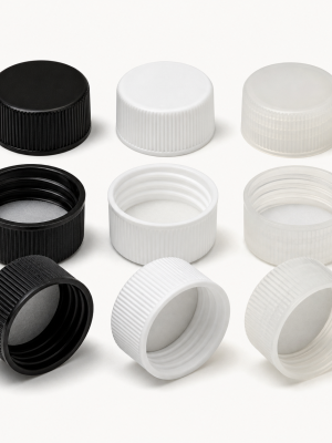 Ribbed plastic screw caps showing threads and sealing liners