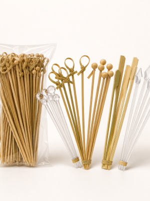 Assorted disposable bamboo and clear plastic cocktail garnish picks