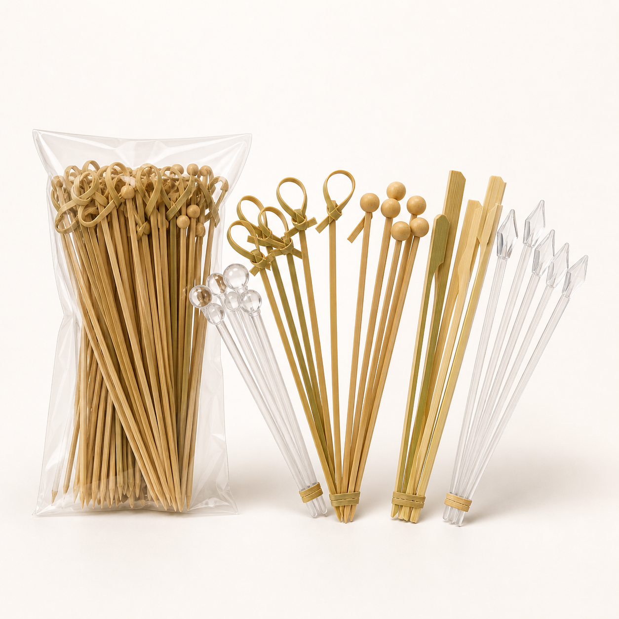 Assorted disposable bamboo and clear plastic cocktail garnish picks