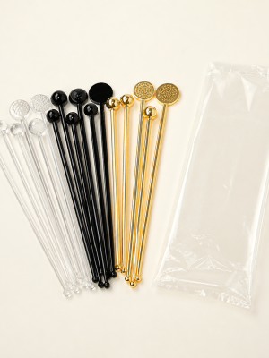 Decorative clear black and gold cocktail swizzle sticks