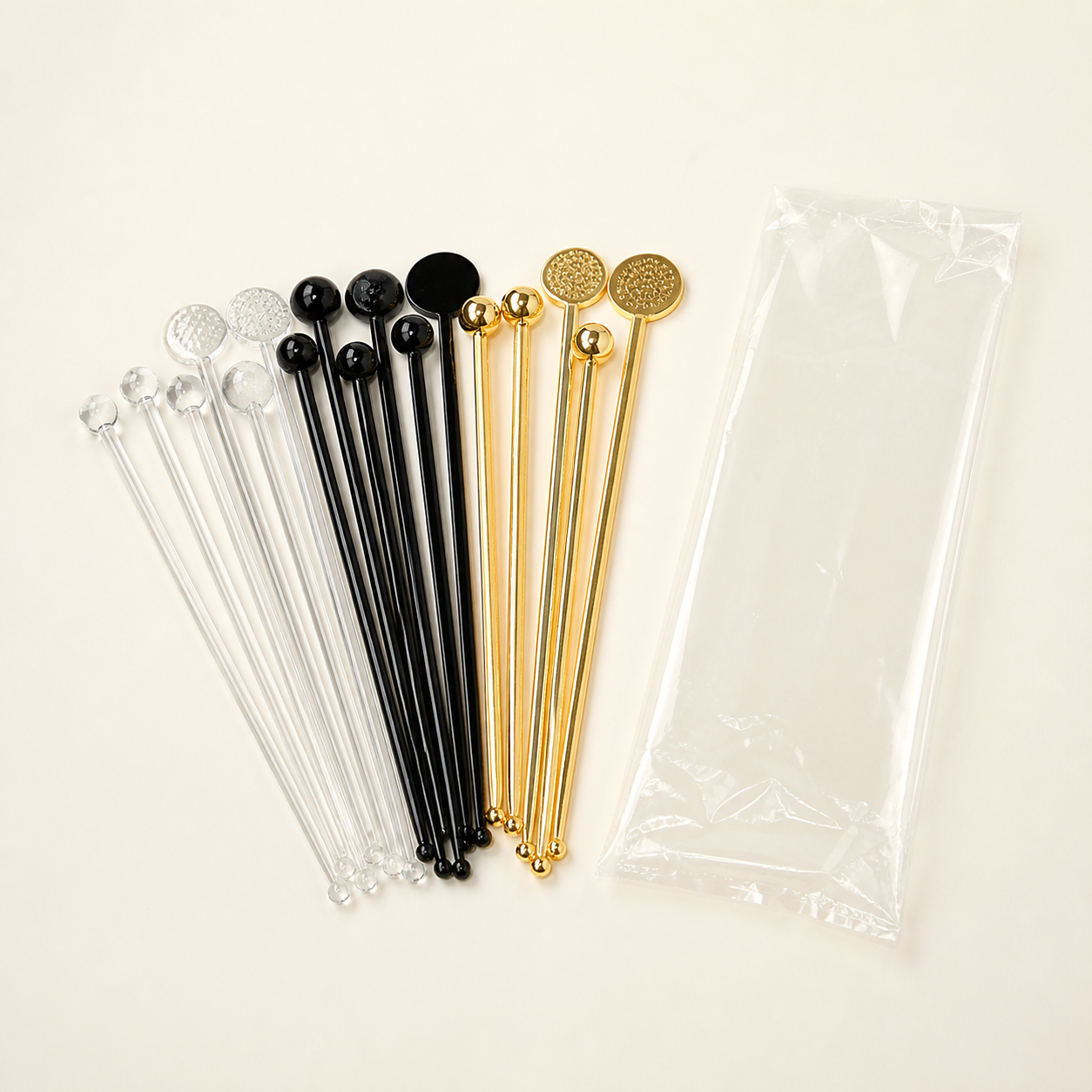 Decorative clear black and gold cocktail swizzle sticks