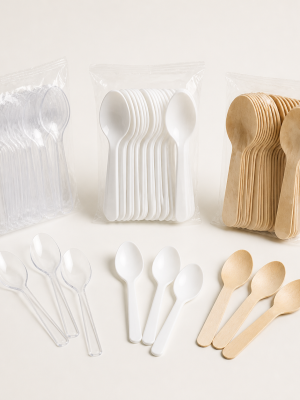 Compact disposable clear white and birchwood dessert spoons