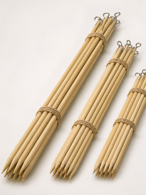Long sturdy pointed wooden espetada sticks with hanging ends