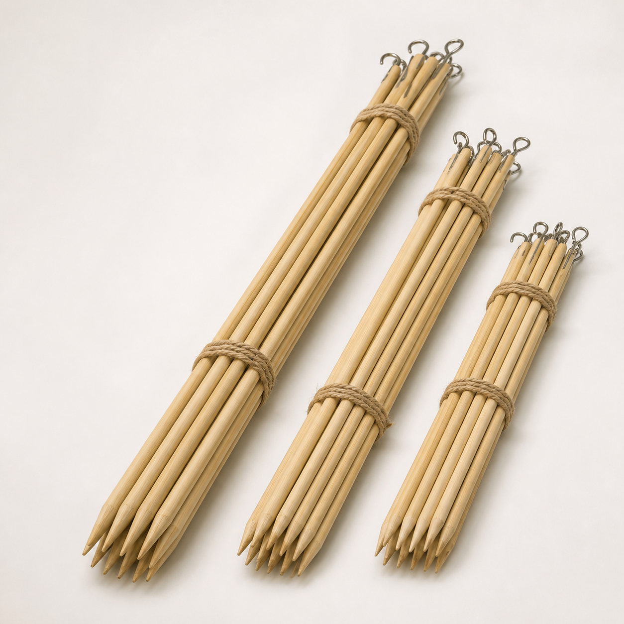 Long sturdy pointed wooden espetada sticks with hanging ends