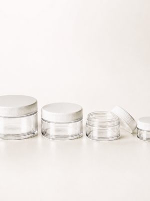 Clear flint cosmetic ointment jars with white screw lids