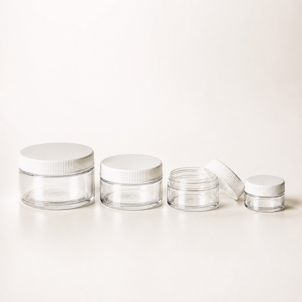 Clear flint cosmetic ointment jars with white screw lids