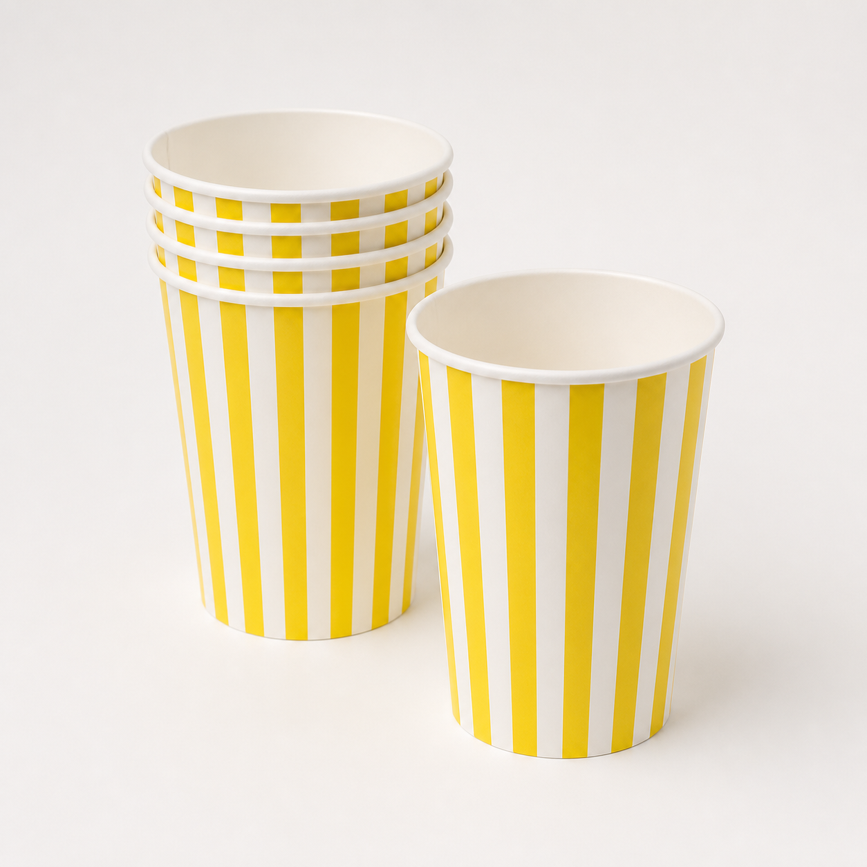 Yellow and white striped paper popcorn tubs