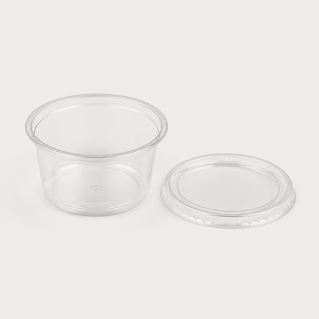 Clear plastic sauce portion tub and lid