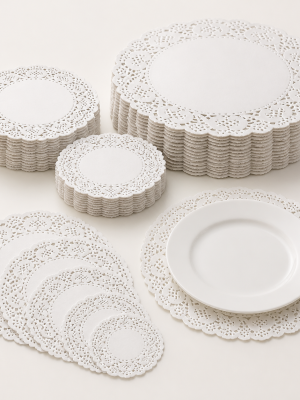 Round white lace-pattern paper doilies in assorted diameters