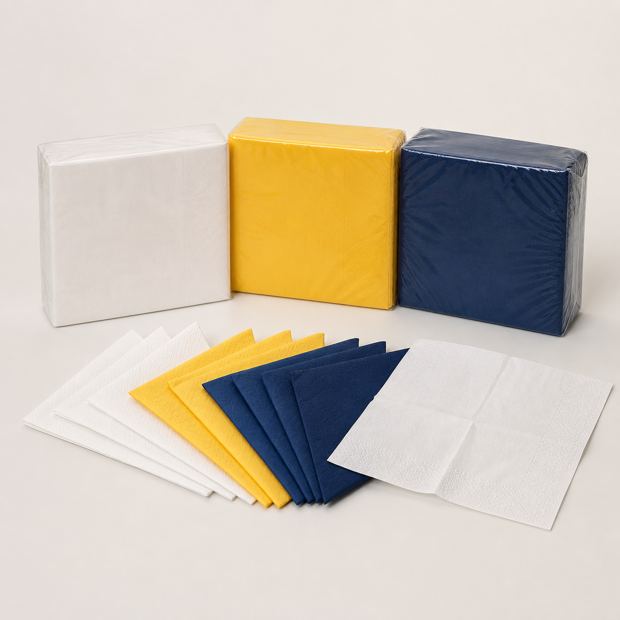 Standard two-ply paper serviettes in white yellow and navy