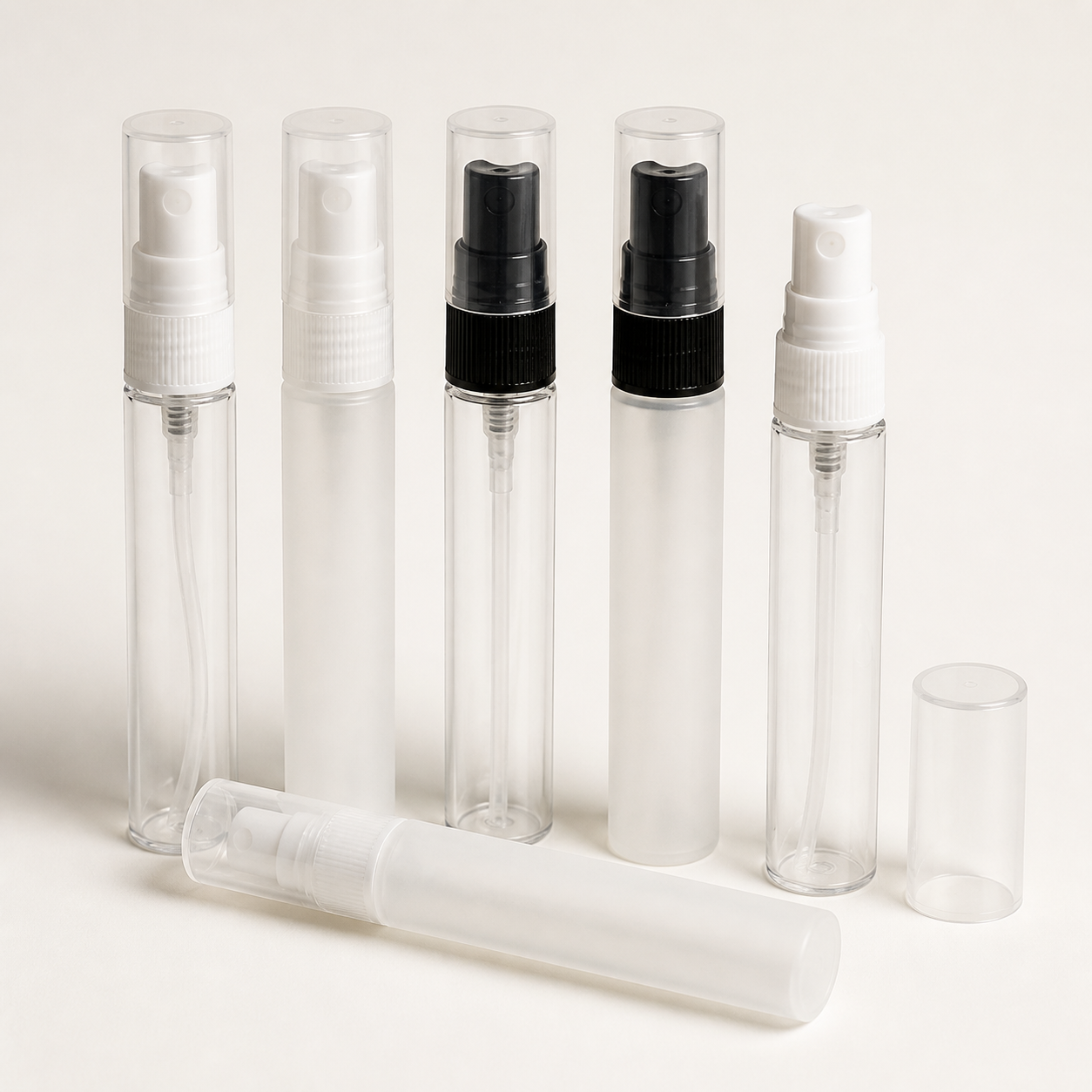 Slim clear and frosted pen-shaped fine mist spray bottles