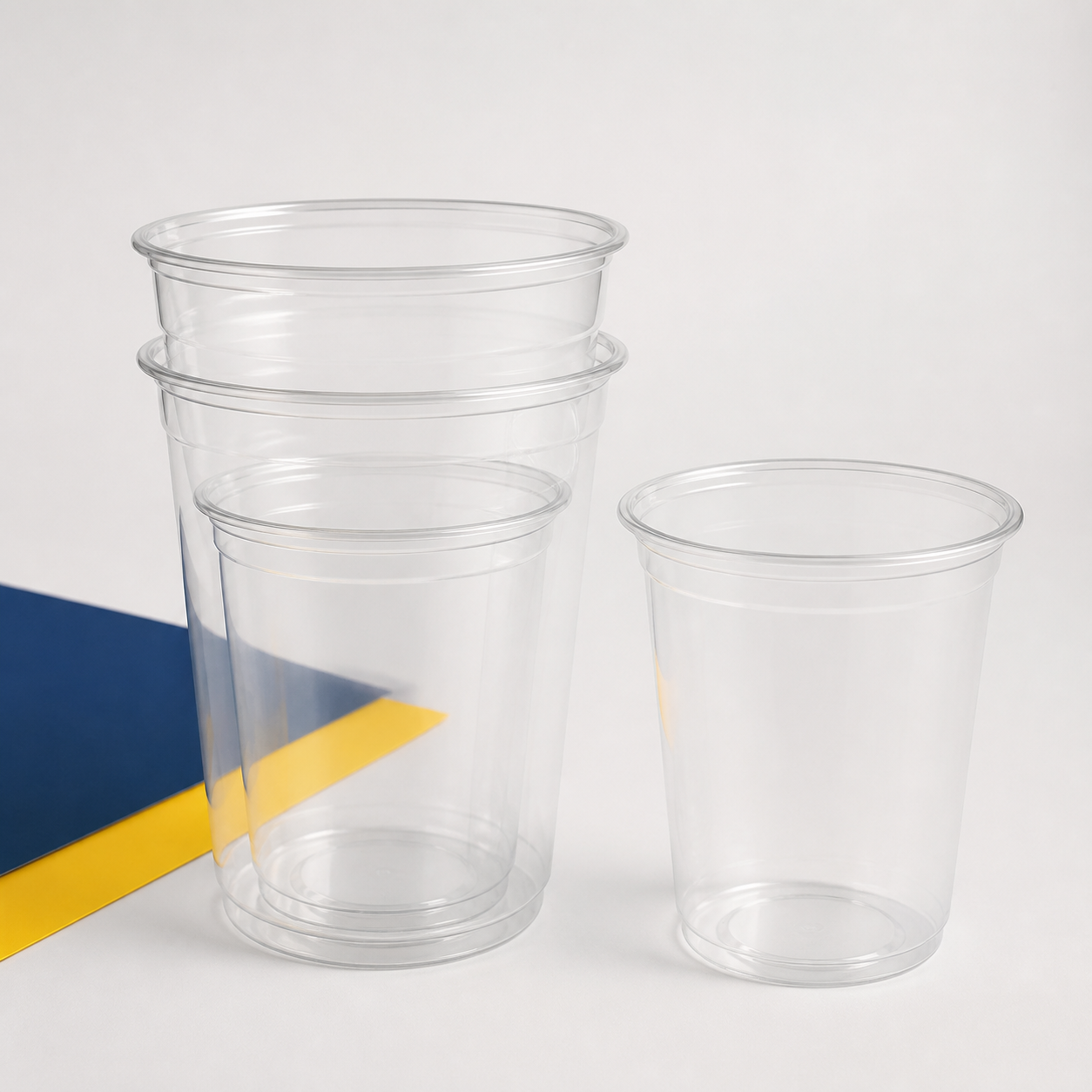 Empty clear compostable PLA smoothie cups in assorted sizes