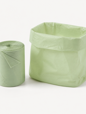 Small pale green home-compostable kitchen caddy liners