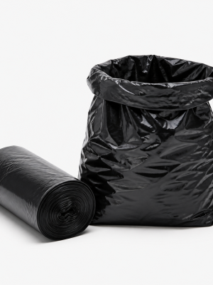 Heavy-duty black refuse bags with a roll