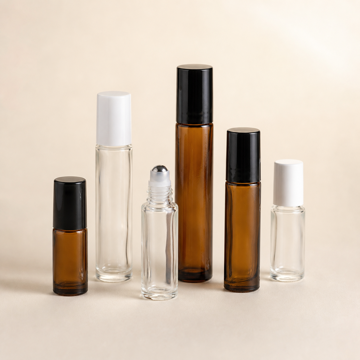 Clear and amber glass roll-on bottles with roller-ball inserts