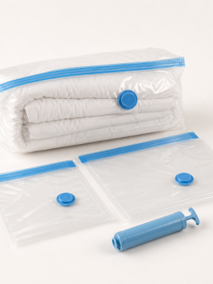Reusable clear vacuum compression storage bags with blue seals valves and hand pump